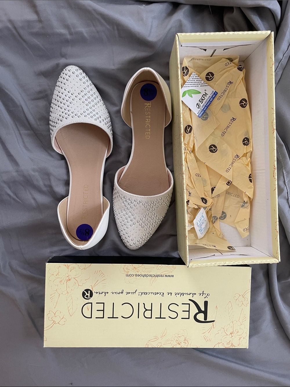 Restricted White Flats w/ silver embellishments